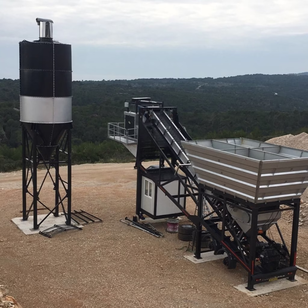 Mobile cement silo and concrete batching plant setup by Polygon Machine on a construction site.