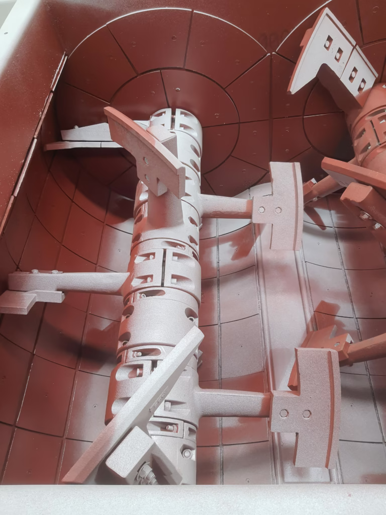 High-performance mixing blades inside a Polygonmach mortar and concrete mixer.